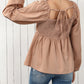 Notched V-Neck Smocked Back Peplum Blouse