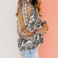 Abstract Print Flounce Sleeve Tasseled V Neck Blouse
