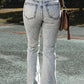 Distressed Light Washed Slit Knee Flared Jeans