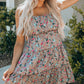Flower Print Tiered Frilled Knotted Spaghetti Strap Mini Dress