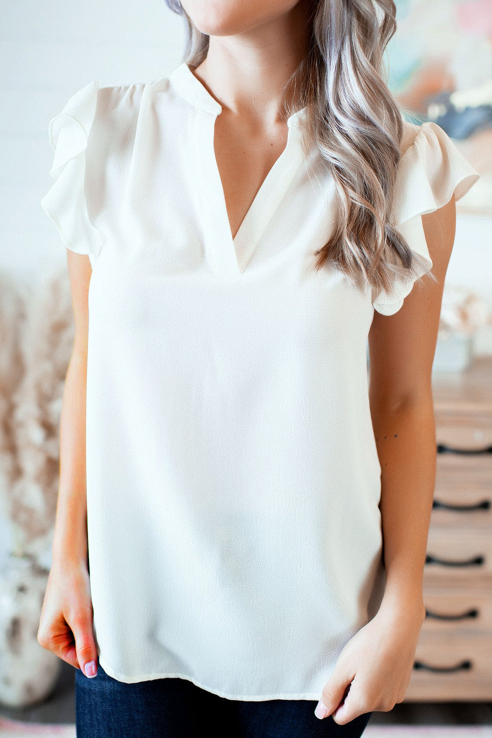 Ruffled Sleeveless V Neck Top